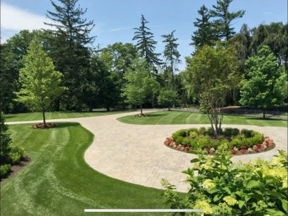 Finished lawn and paver driveway landscaping by R&R