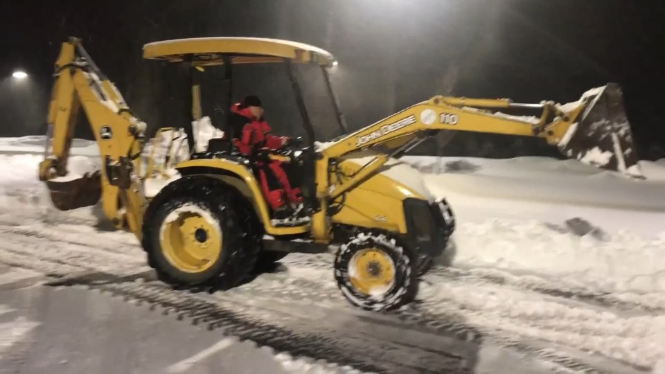 R&R snow and ice management equipment clearing a commercial property