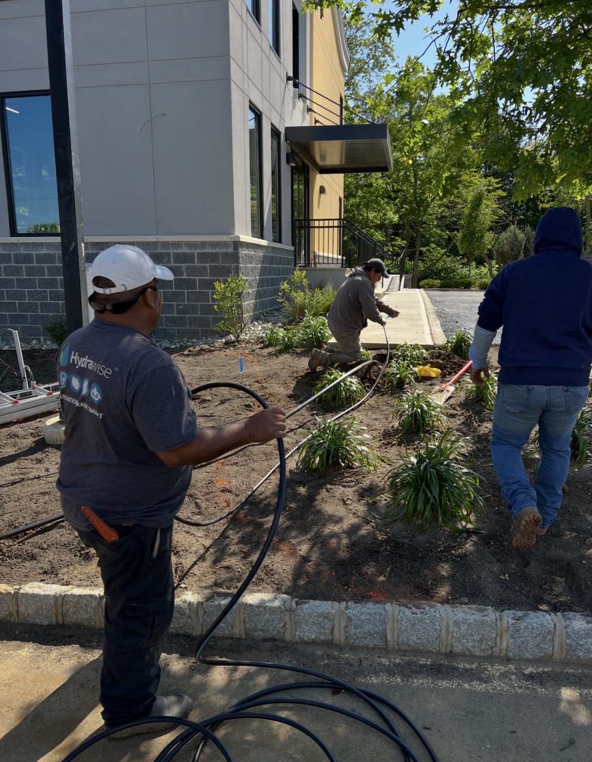 R&R irrigation crew working by a commercial building